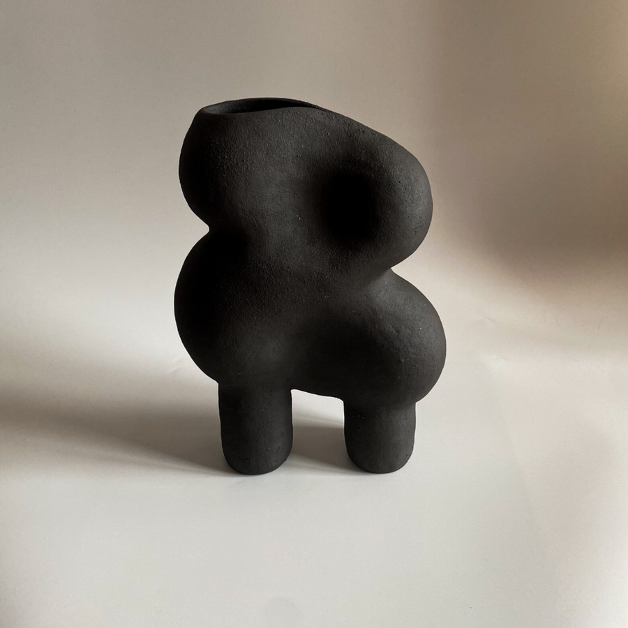 Black Sculpture with Legs